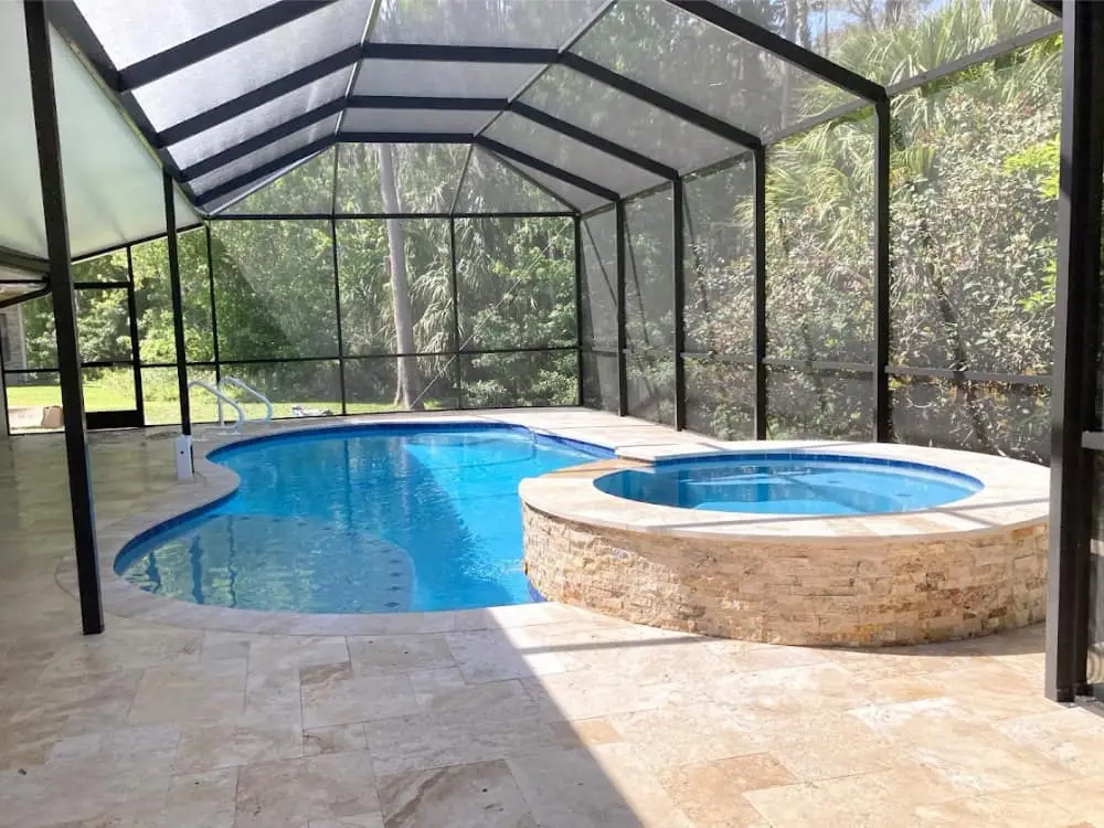 holly hill pool builder backyard with pool, spa and screen pool enclosure