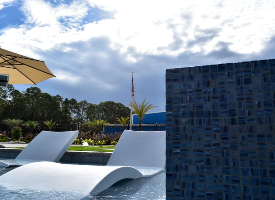 ledge loungers at Agua Pools St. Johns Display Center Showroom