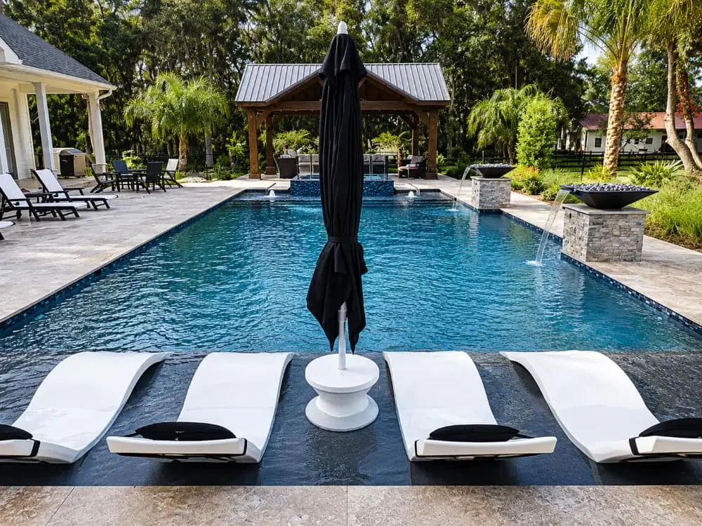 pool, tanning ledge with table on sun shelf, ledge loungers